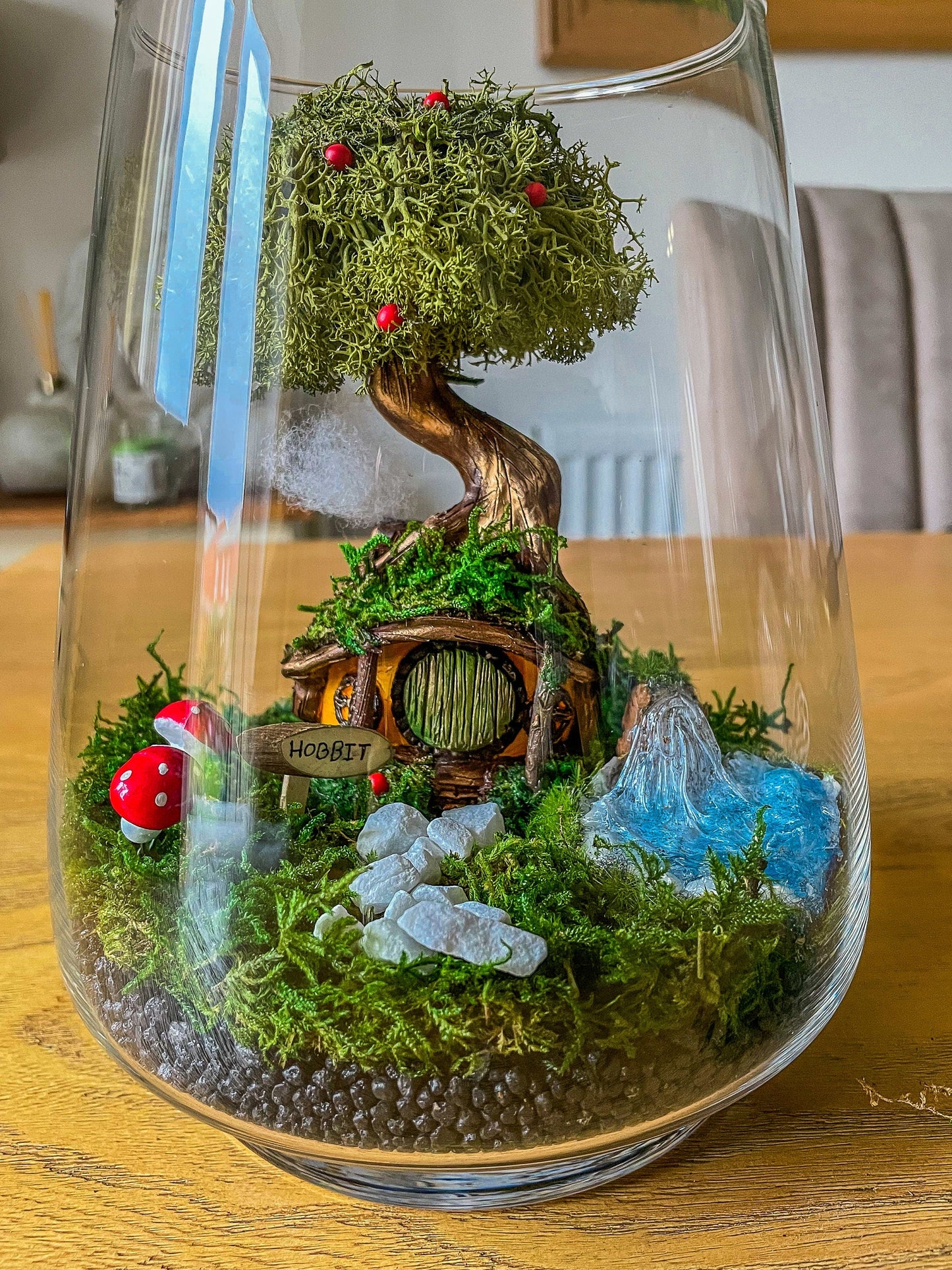 Inside the box: Hobbit door, preserved moss, and terrarium stones