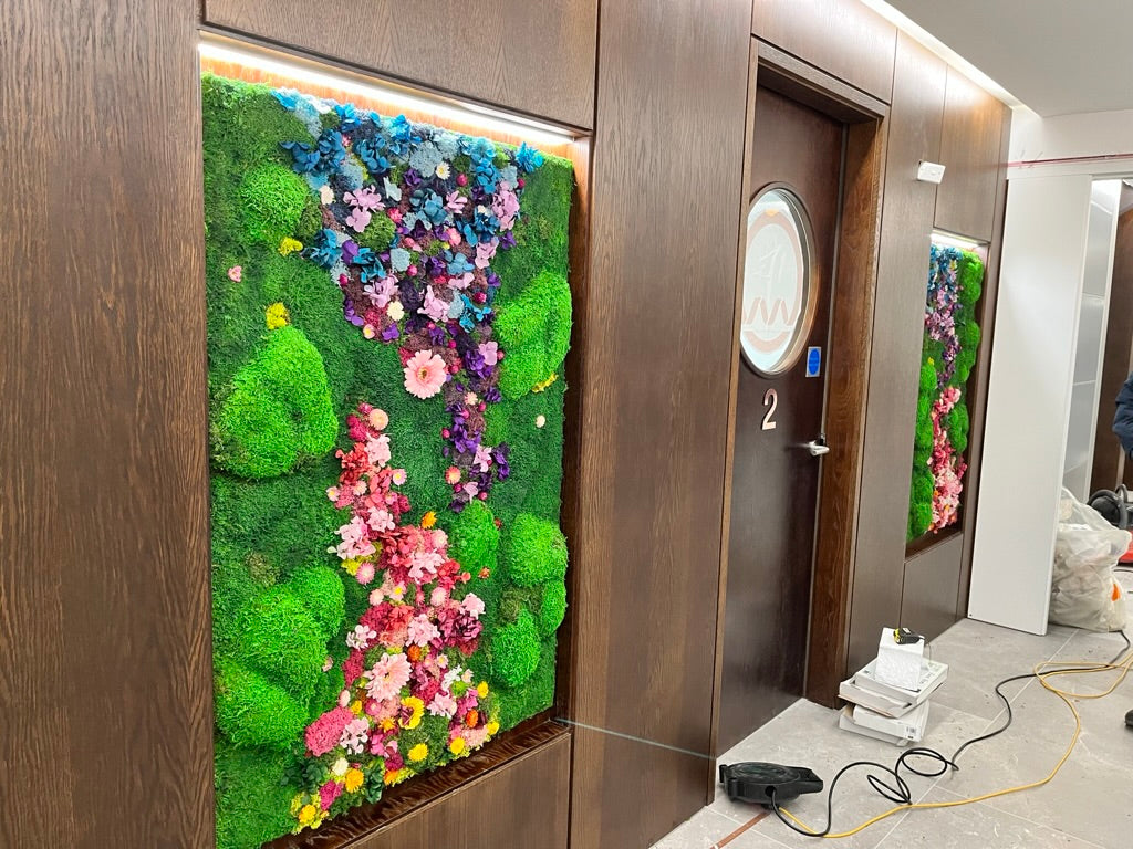 Decorative wall with greenery and flowers in a modern interior setting